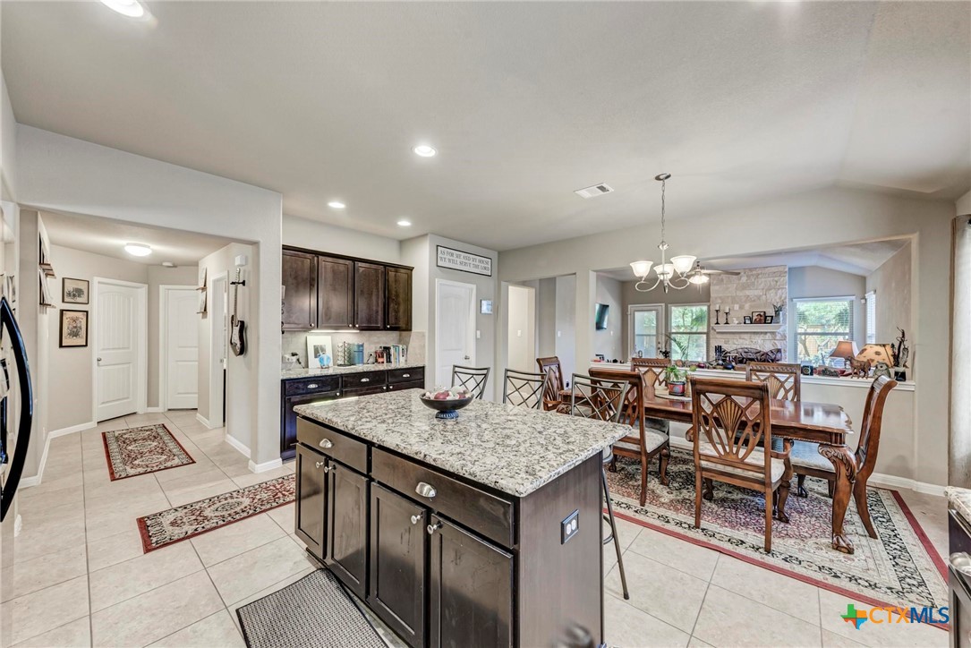 700 Cortona Cove Georgetown, TX 78628 - Photo 10 of 46 Kitchen with eat-in area, opens to living room