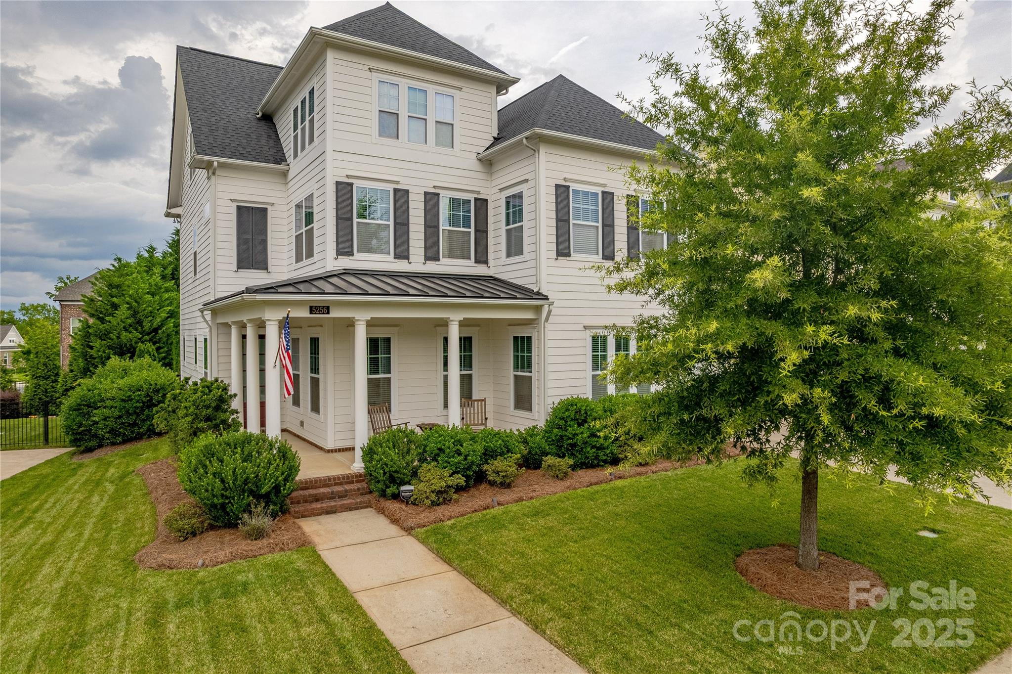 5256 Meadowcroft Way Fort Mill, SC 29708 - Photo 2 of 48 a front view of a house with a garden