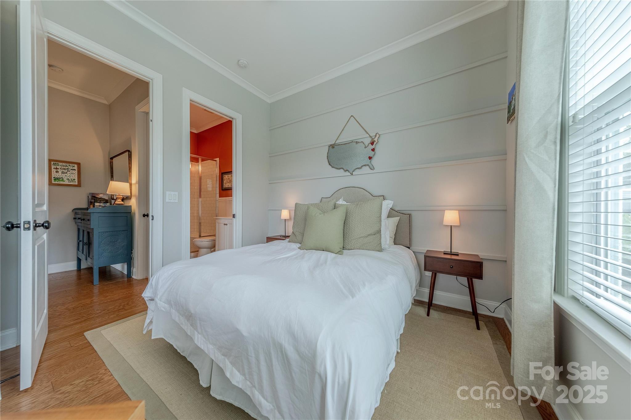 5256 Meadowcroft Way Fort Mill, SC 29708 - Photo 21 of 48 a bedroom with a bed and a chandelier