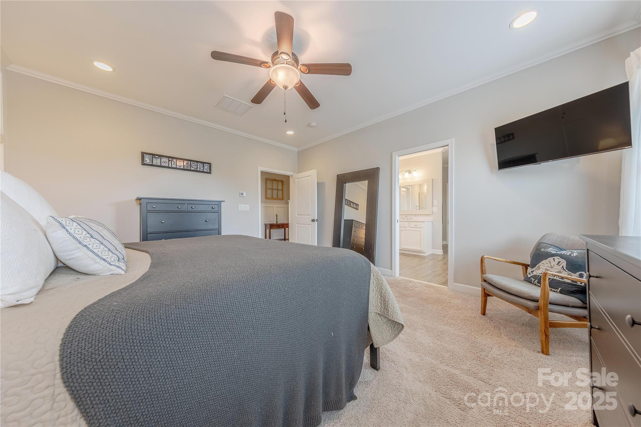 5256 Meadowcroft Way Fort Mill, SC 29708 - Photo 27 of 48 a bedroom with a bed and a flat screen tv