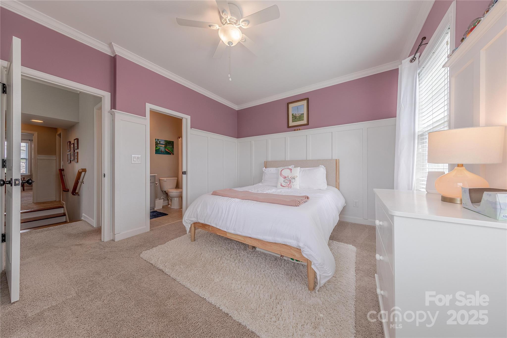 5256 Meadowcroft Way Fort Mill, SC 29708 - Photo 33 of 48 a bedroom with a bed and a chandelier