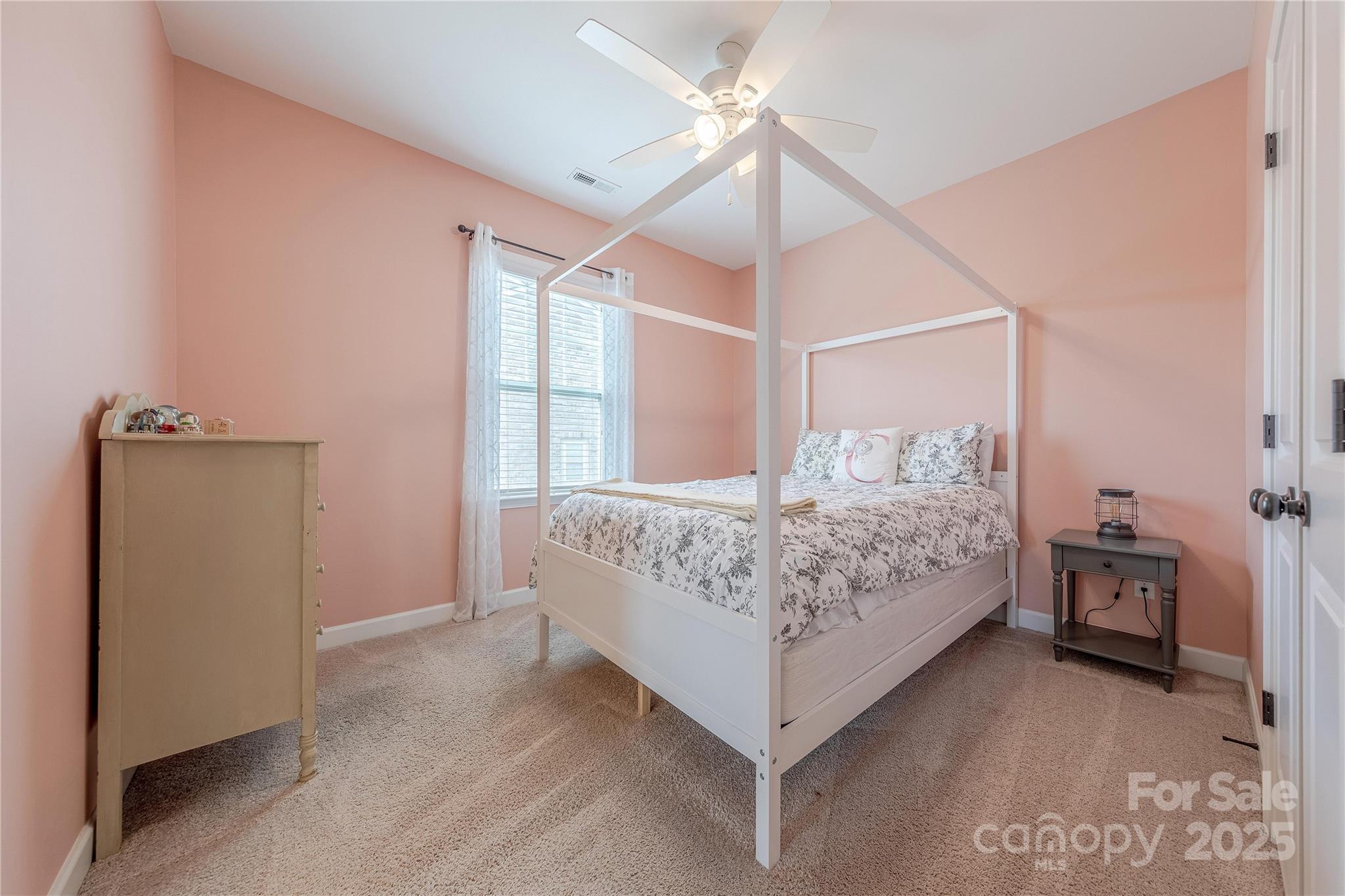 5256 Meadowcroft Way Fort Mill, SC 29708 - Photo 35 of 48 a bedroom with a bed and a chandelier