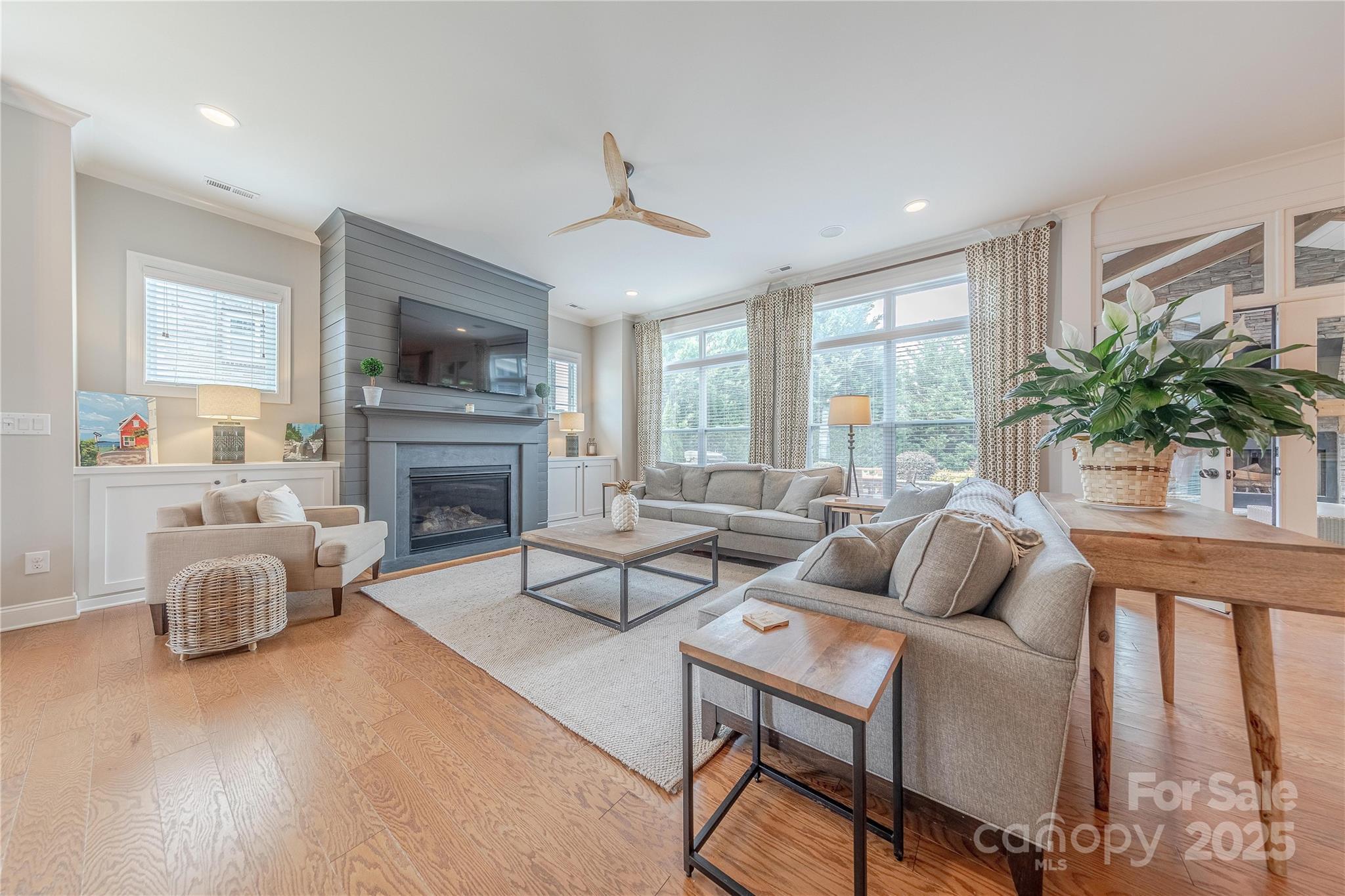 5256 Meadowcroft Way Fort Mill, SC 29708 - Photo 6 of 48 a living room with furniture fireplace and a large window