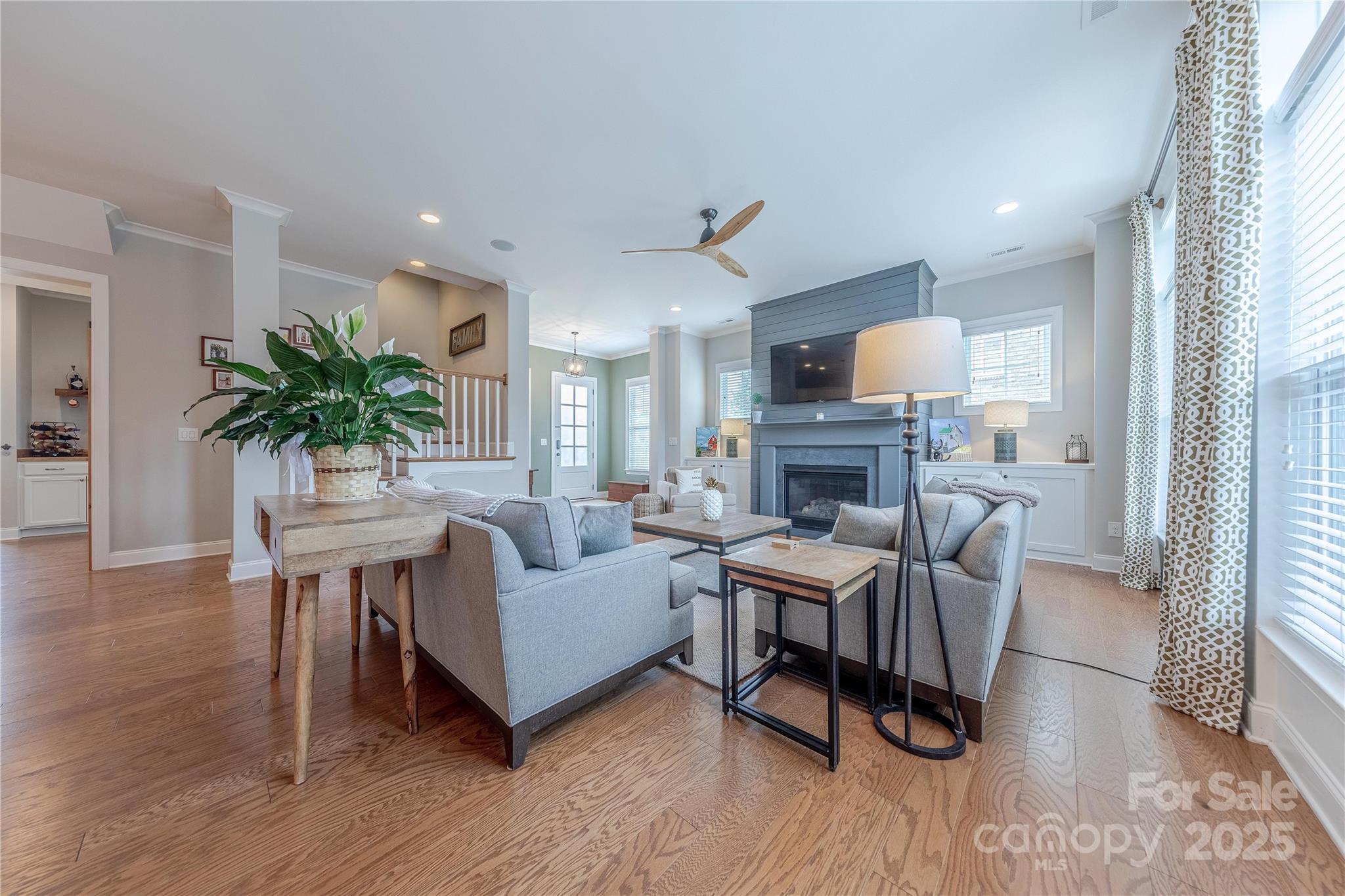 5256 Meadowcroft Way Fort Mill, SC 29708 - Photo 8 of 48 a living room with furniture a fireplace and a flat screen tv