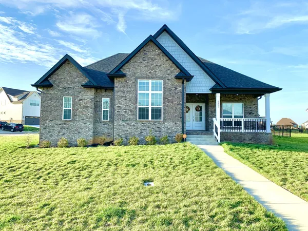 a front view of a house with a yard