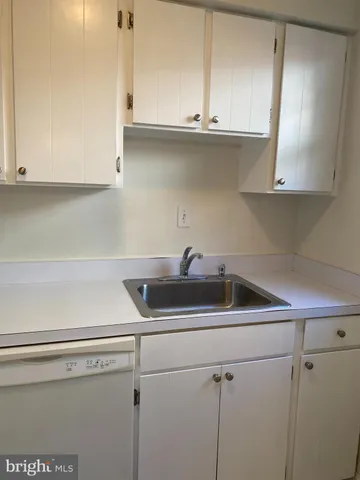 a white refrigerator freezer sitting in a kitchen
