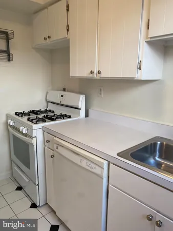 a white refrigerator freezer sitting in a kitchen