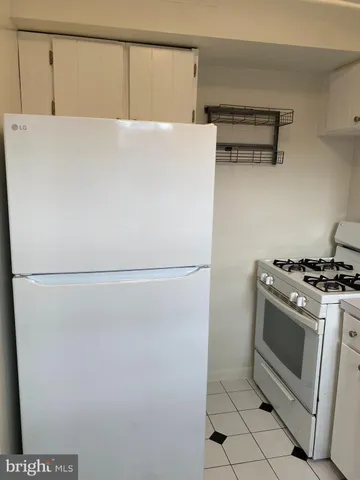 a close view of sink and cabinets