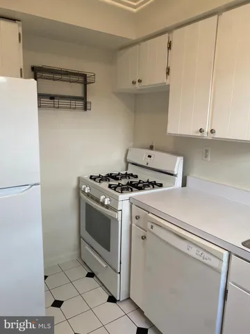 a bathroom with a shower a bath tub and a shower