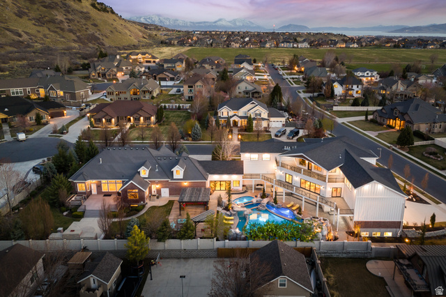 1263 Chapman Court Alpine, UT 84004 - Photo 16 of 83 Aerial view at dusk of a mountain view and view of pool