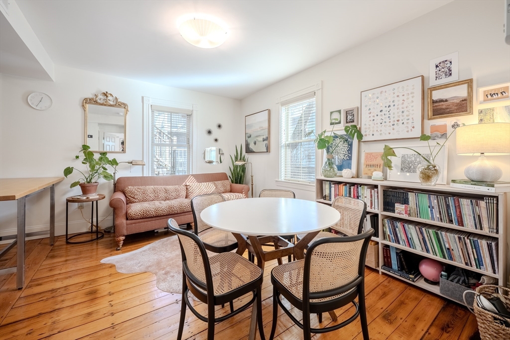 20 Porter Street, Unit 2 Boston, MA 02130 - Photo 14 of 35 a living room with furniture a bookshelf and a bookshelf