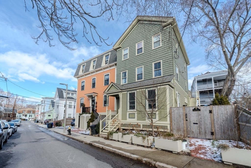 20 Porter Street, Unit 2 Boston, MA 02130 - Photo 18 of 35 a front view of a house with a yard