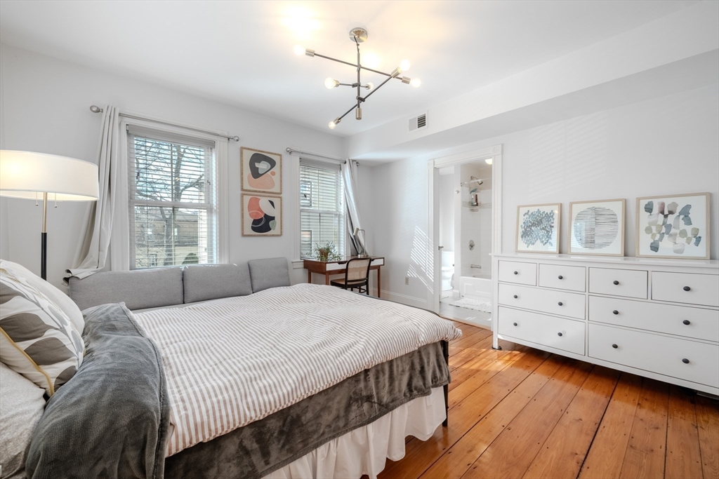 20 Porter Street, Unit 2 Boston, MA 02130 - Photo 24 of 35 a bedroom with a bed a window and dresser