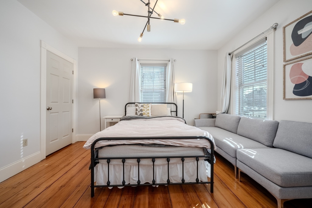 20 Porter Street, Unit 2 Boston, MA 02130 - Photo 28 of 35 a bedroom with a bed couch and a window