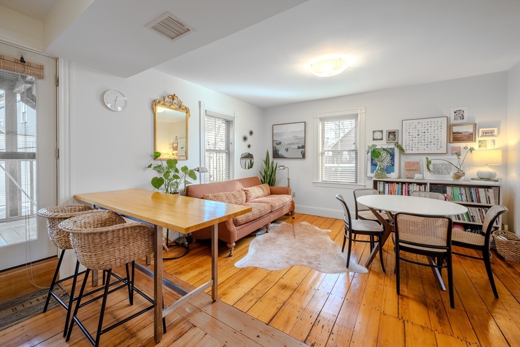 20 Porter Street, Unit 2 Boston, MA 02130 - Photo 5 of 35 a view of a dining room with furniture and wooden floor