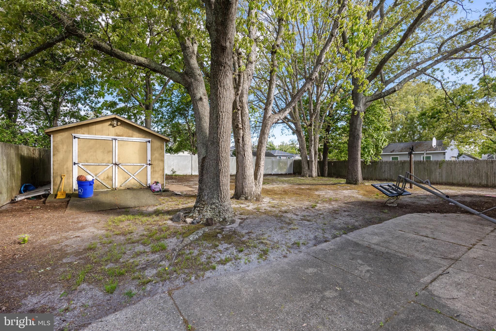 109 North Ambler Road Somers Point, NJ 08244 - Photo 22 of 22 a view of a house with backyard and a tree