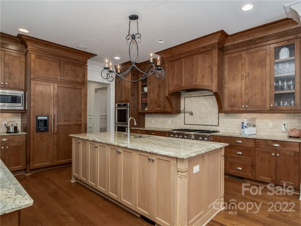 14140 Claysparrow Road Charlotte, NC 28278 - Photo 15 of 48 a kitchen with a sink stove and refrigerator