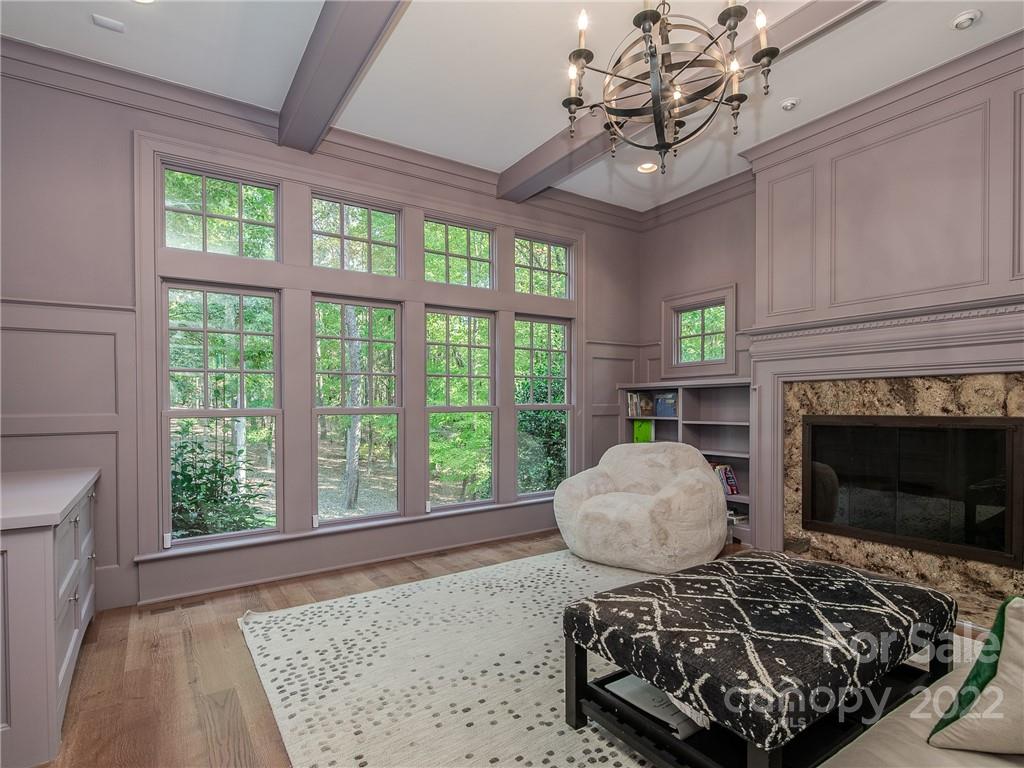 14140 Claysparrow Road Charlotte, NC 28278 - Photo 22 of 48 a living room with furniture and a fireplace