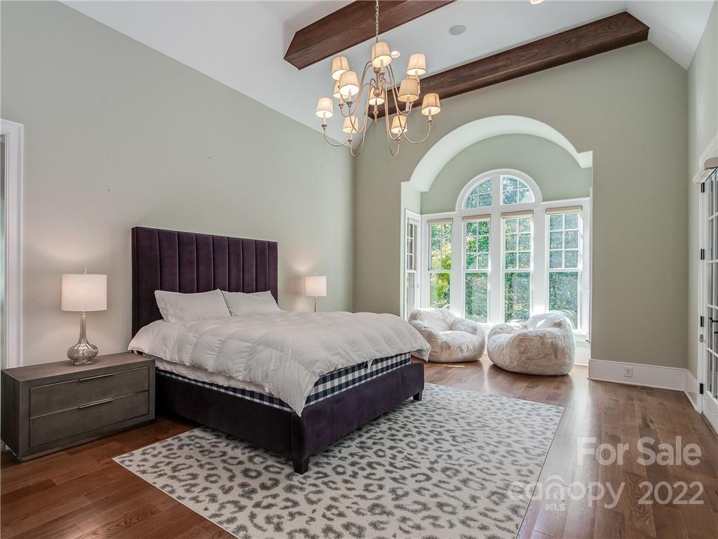 14140 Claysparrow Road Charlotte, NC 28278 - Photo 23 of 48 a spacious bedroom with a bed and a window
