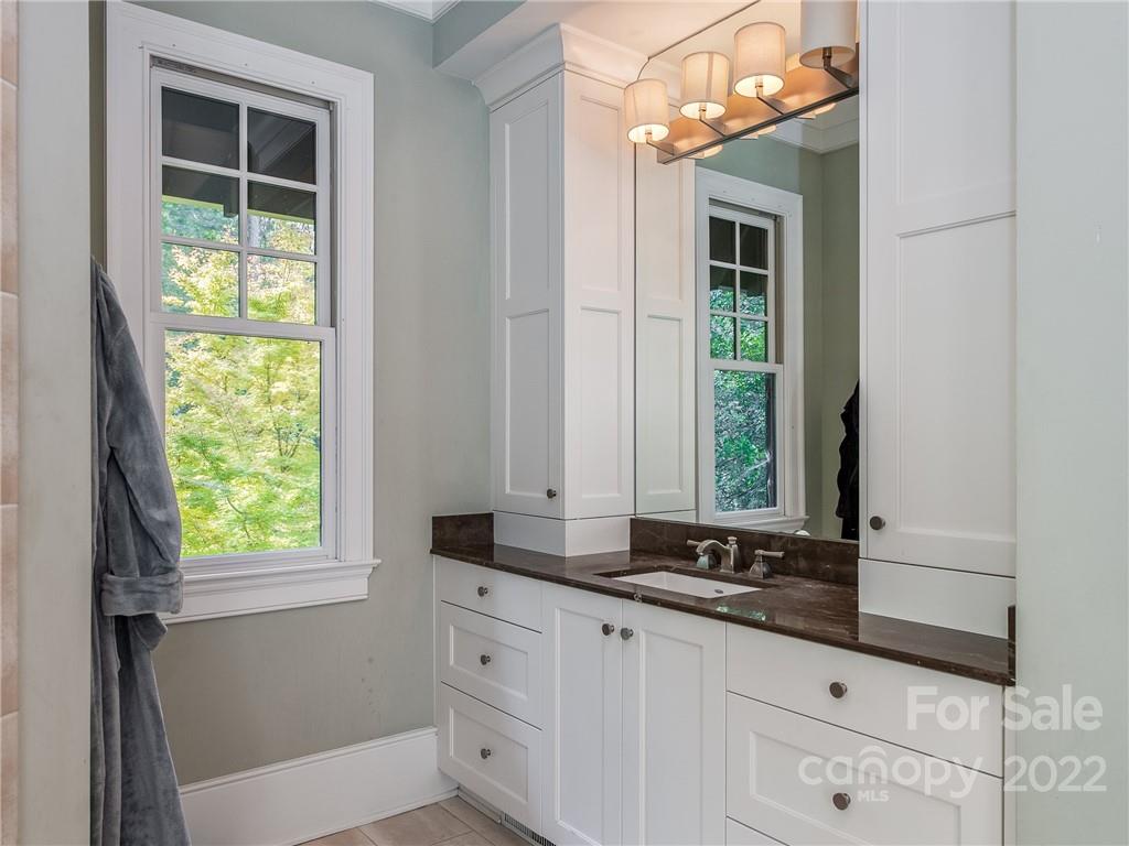 14140 Claysparrow Road Charlotte, NC 28278 - Photo 26 of 48 a bathroom with a sink and a mirror