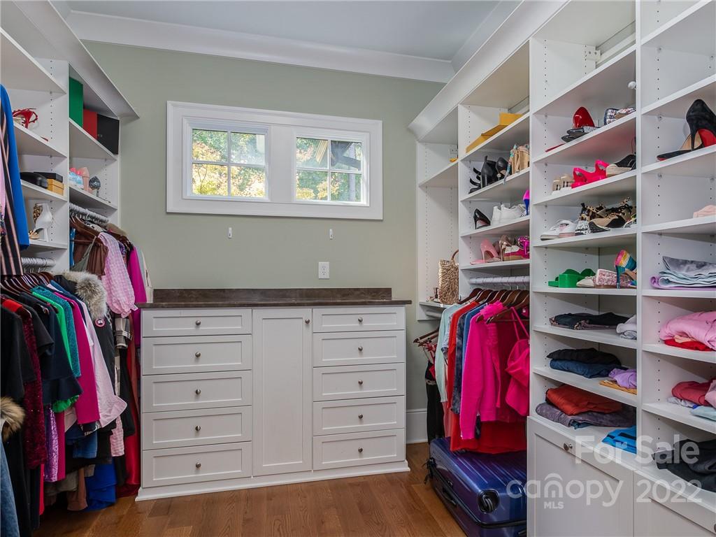 14140 Claysparrow Road Charlotte, NC 28278 - Photo 28 of 48 a view of walk in closet with clothes and shoes