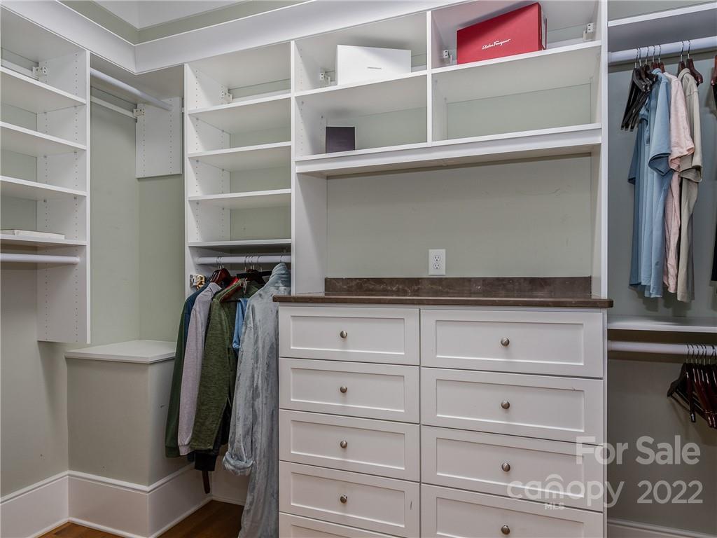 14140 Claysparrow Road Charlotte, NC 28278 - Photo 29 of 48 a view of walk in closet with clothes and shoes