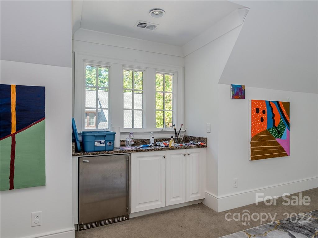 14140 Claysparrow Road Charlotte, NC 28278 - Photo 36 of 48 a kitchen with stainless steel appliances a sink a stove a refrigerator and window