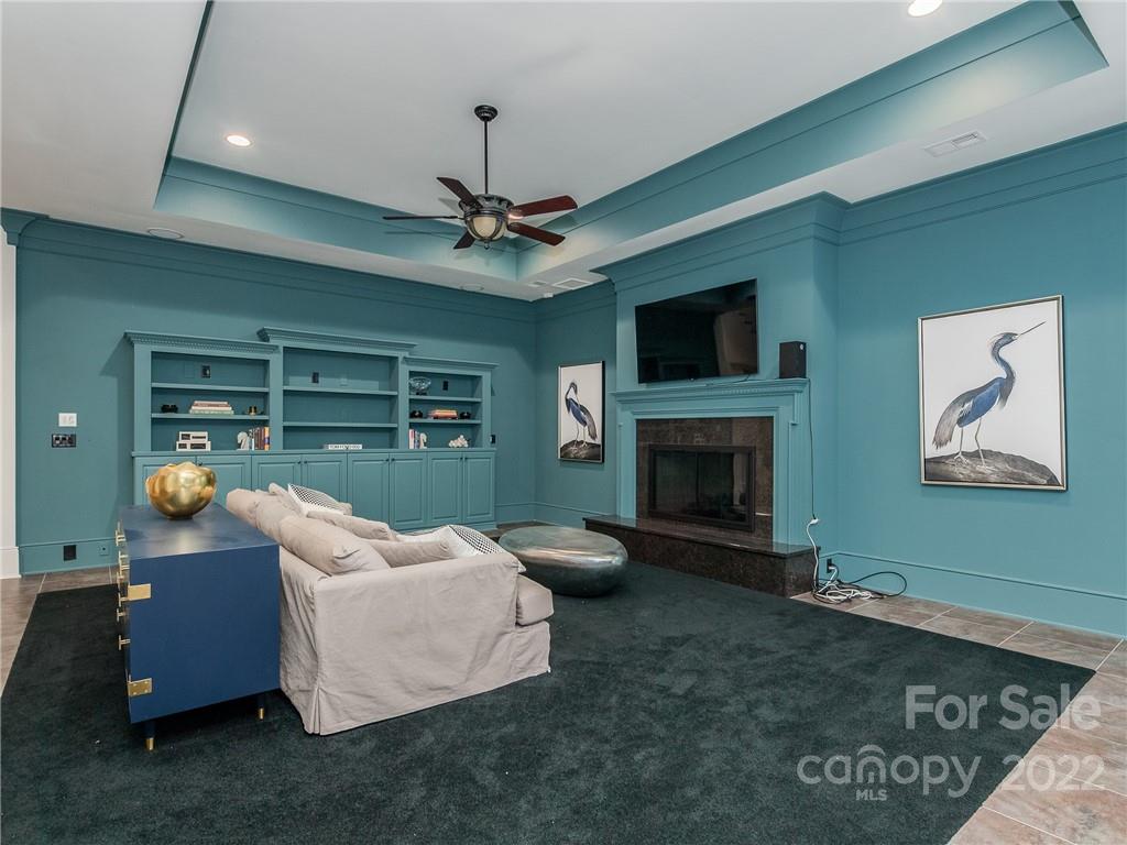14140 Claysparrow Road Charlotte, NC 28278 - Photo 37 of 48 a living room with furniture and a fireplace