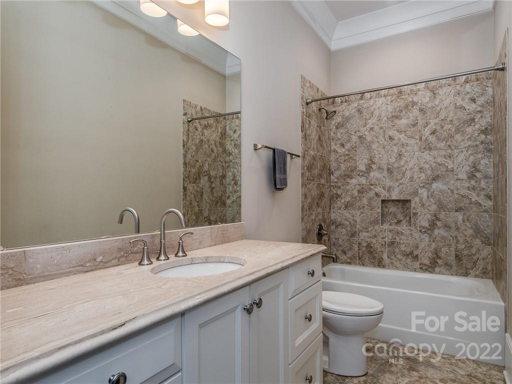 14140 Claysparrow Road Charlotte, NC 28278 - Photo 42 of 48 a bathroom with a granite countertop sink toilet and shower