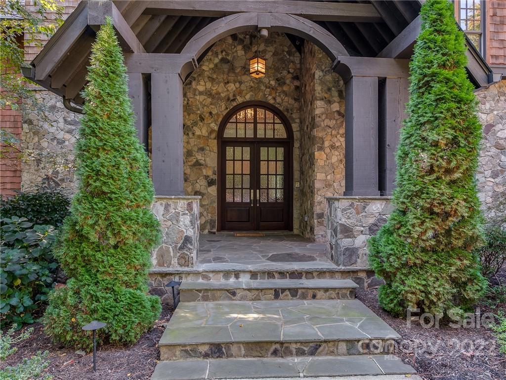 14140 Claysparrow Road Charlotte, NC 28278 - Photo 6 of 48 a front view of a house with garden