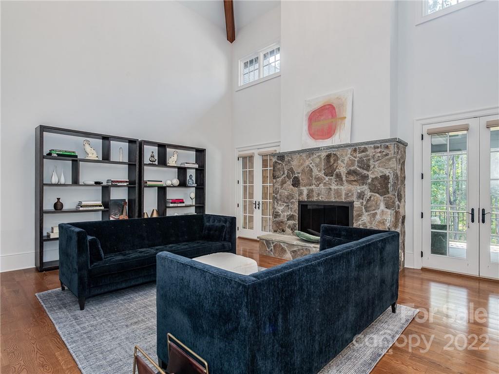 14140 Claysparrow Road Charlotte, NC 28278 - Photo 10 of 48 a living room with furniture and a fireplace