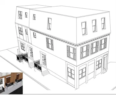 a red building in front of a brick building