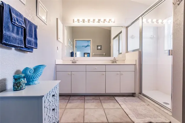 a bathroom with a sink a vanity and a mirror