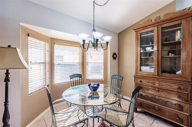 a dining room with furniture and window