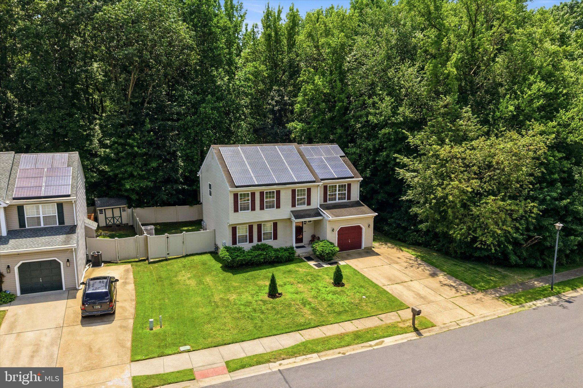 915 Rue Madora Bear, DE 19701 - Photo 8 of 14 Charming home nestled by lush greenery.