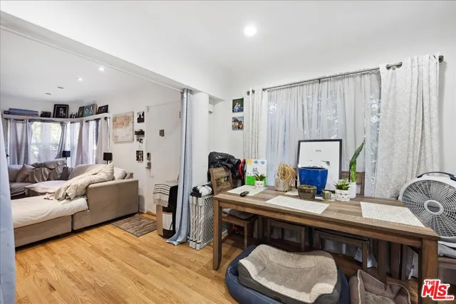 a bedroom with bed and window