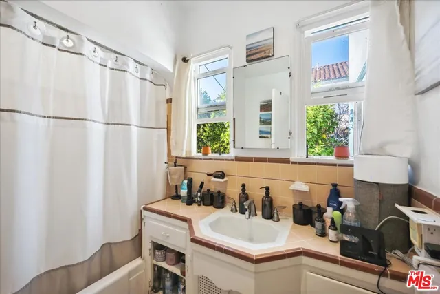 a kitchen with stainless steel appliances granite countertop a refrigerator and a stove