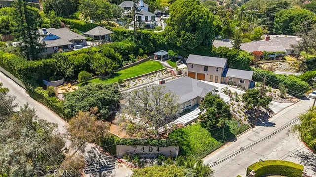 an aerial view of a house with a garden