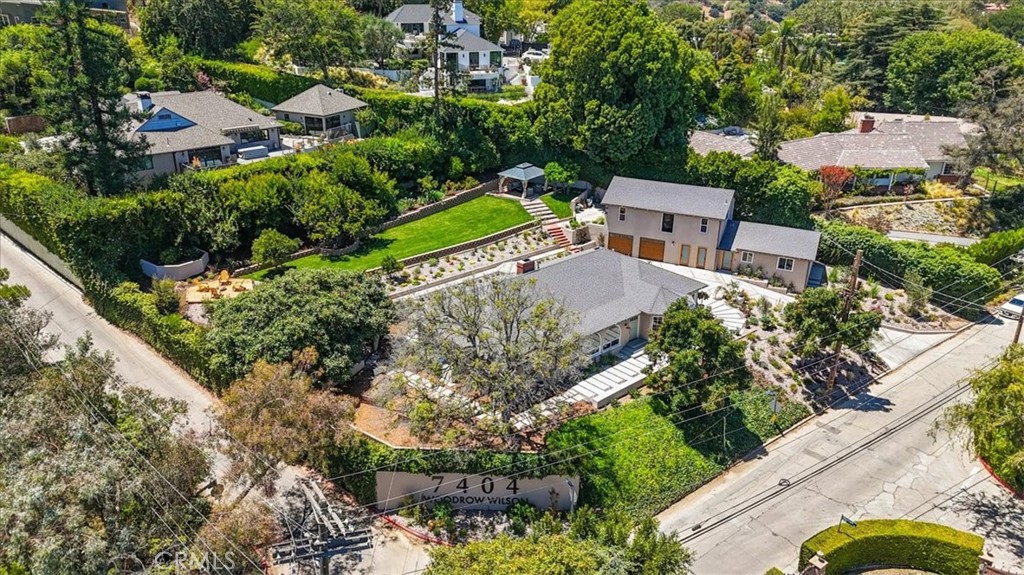 an aerial view of a house with a garden