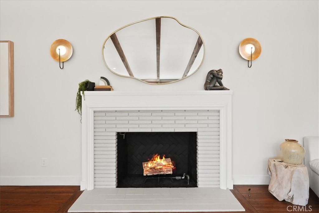 7404 Woodrow Wilson Drive Los Angeles, CA 90046 - Photo 13 of 57 a living room with furniture a fireplace and a large window