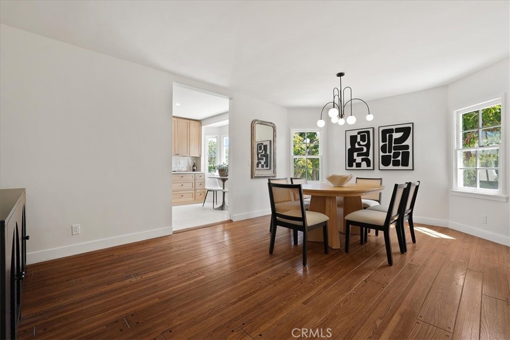 7404 Woodrow Wilson Drive Los Angeles, CA 90046 - Photo 15 of 57 a view of a dining room with furniture and wooden floor