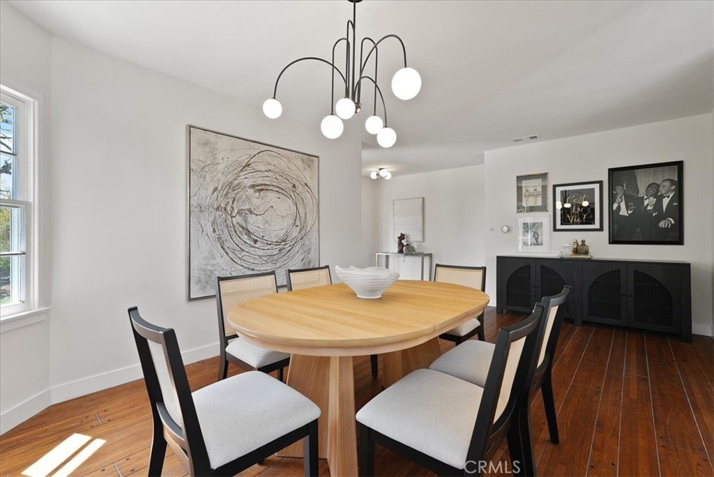 7404 Woodrow Wilson Drive Los Angeles, CA 90046 - Photo 16 of 57 a view of a dining room with furniture and wooden floor