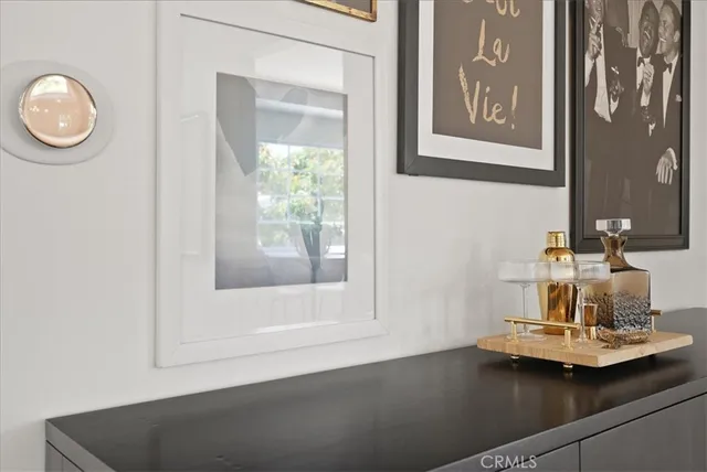 a spacious bedroom with a bed and wooden floor