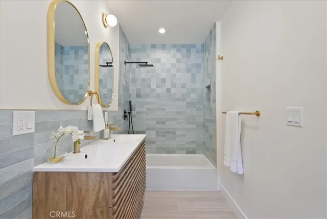 a white bath tub sitting next to a white door