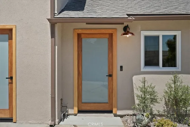 a kitchen with appliances a sink and cabinets