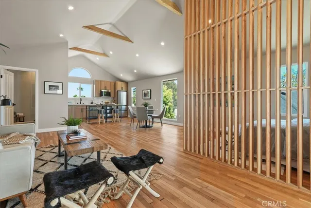 a kitchen with a table chairs sink and refrigerator