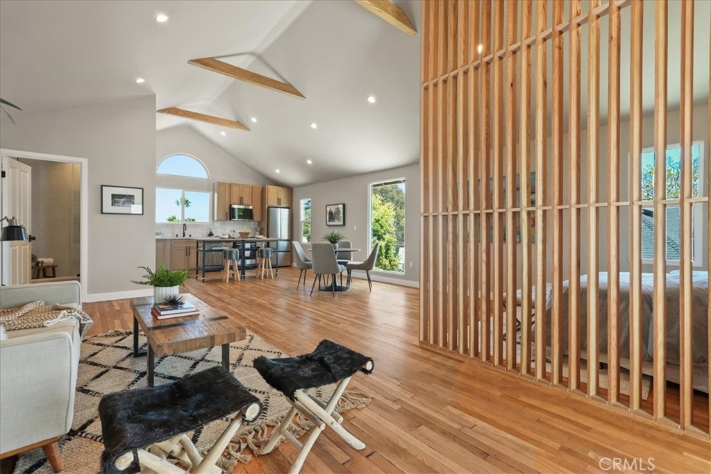 7404 Woodrow Wilson Drive Los Angeles, CA 90046 - Photo 40 of 57 a living room with furniture and a wooden floor