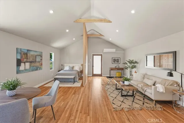 a view of a house with a big yard and a large tree