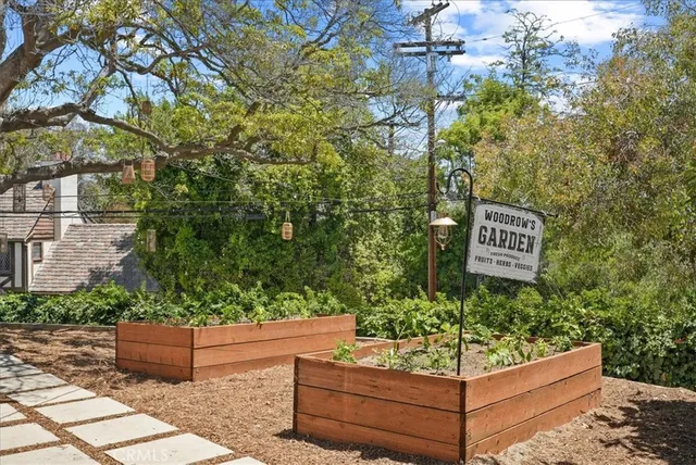 a view of a house with a yard and furniture