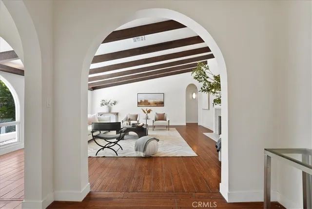 a view of a living room with furniture and a fireplace